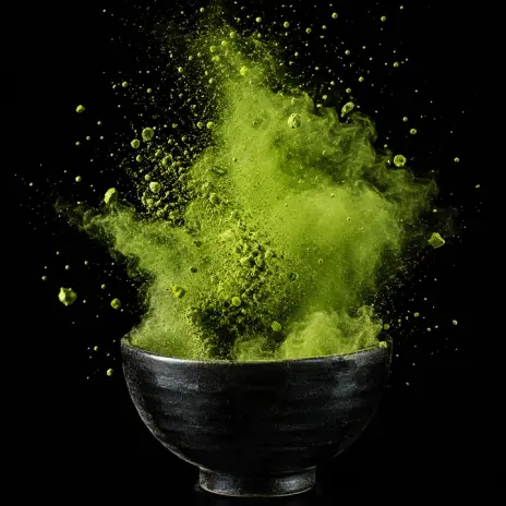 Image made with GPT Image 2.5 Flare: Matcha powder exploding in slow motion above a black ceramic bowl, a green cloud frozen in